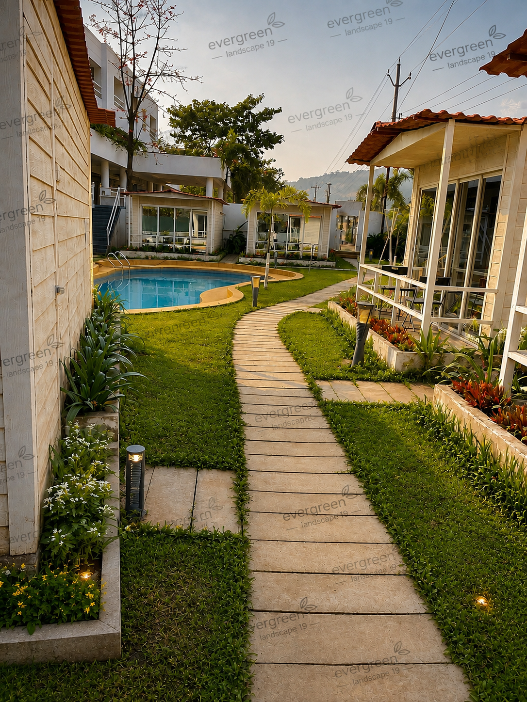 Landscaped garden walkway with ornamental plants and sunset view